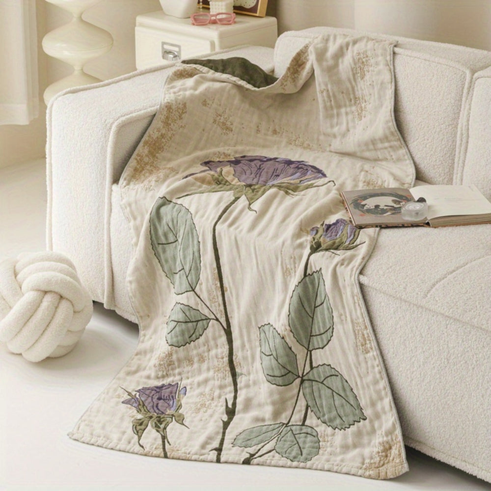 Cream cotton knit blanket with a vintage floral design featuring purple roses and green leaves.
