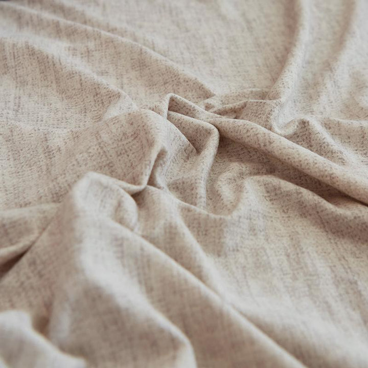 Egg shell colored couch cover with a subtle cross pattern texture.
