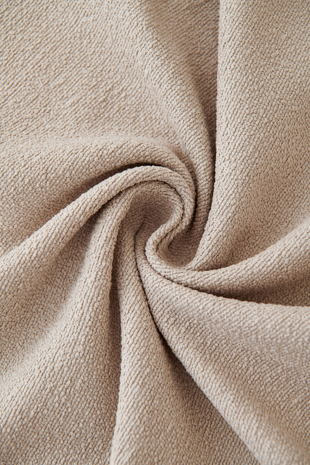 Milk Tea Soft Throw Blanket with textured fabric in a swirl pattern.