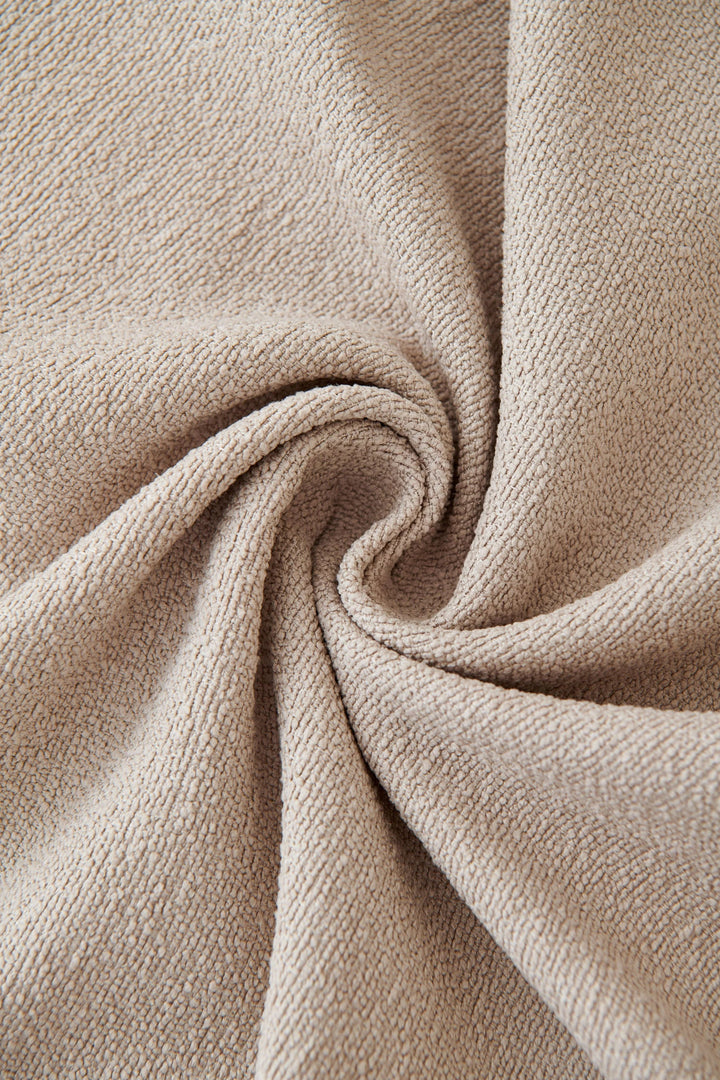 Milk Tea Soft Throw Blanket with textured fabric in a swirl pattern.
