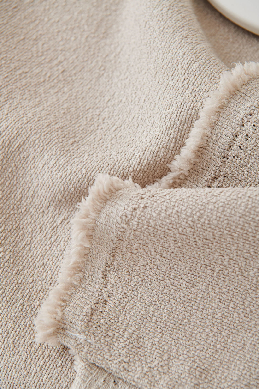 Milk Tea Soft Throw Blanket with fringed edge and textured fabric.
