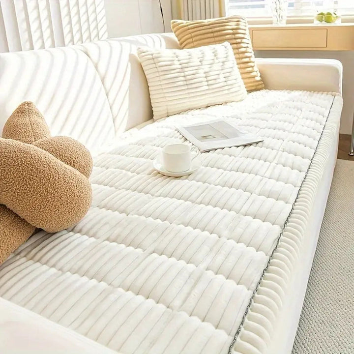 White plush sofa cover with hand-pleated texture, featuring a white cup and saucer and two brown teddy bear-shaped pillows.