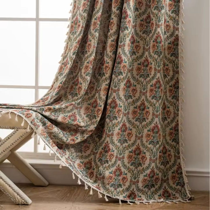 French Vintage Floral Tapestry Curtain with tassels, draped over a bench.