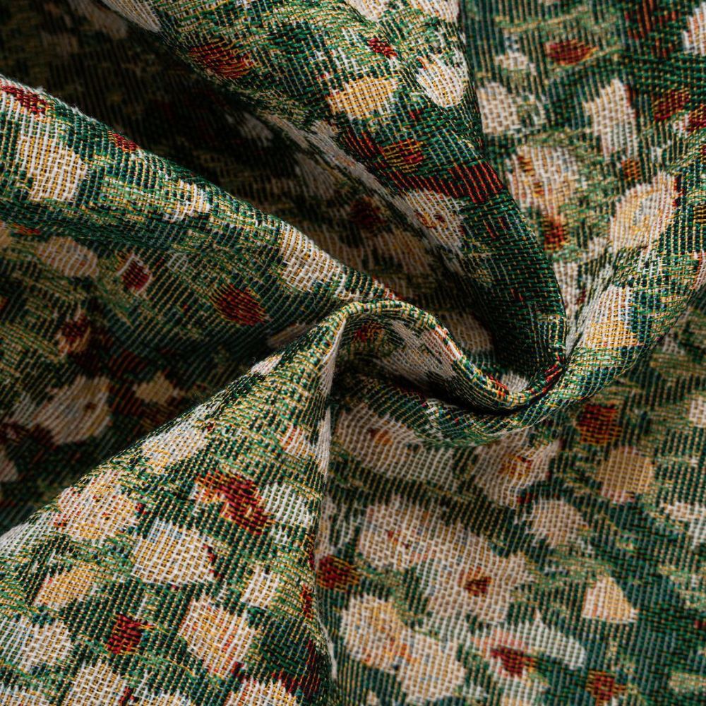 Close-up of a French Vintage Floral Tapestry fabric with green, white, and red floral patterns.