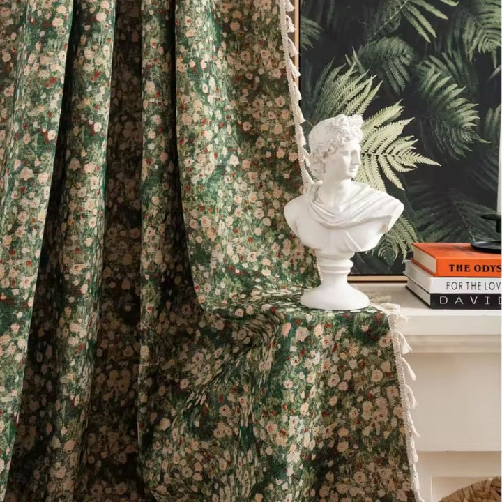 Green floral tapestry curtain with a white bust and books on a shelf.
