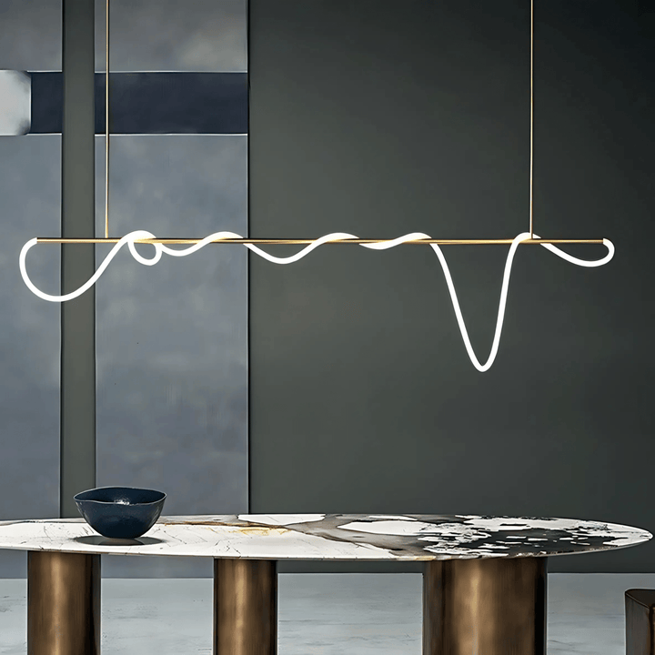 Modern black chandelier with a wavy silicone LED rope suspended from a brass bar.