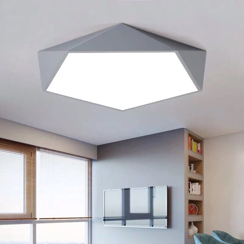 Modern geometric flush mount ceiling light with a white illuminated center and gray angular frame.