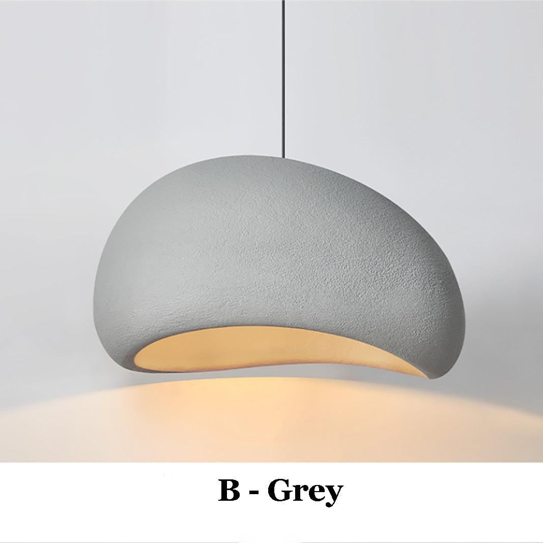 Grey Wabi-Sabi pendant light with a textured finish and warm interior glow.