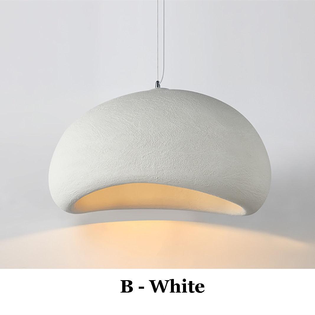 Wabi-Sabi pendant light in off-white, with a textured, organic shape and warm light emanating from within.