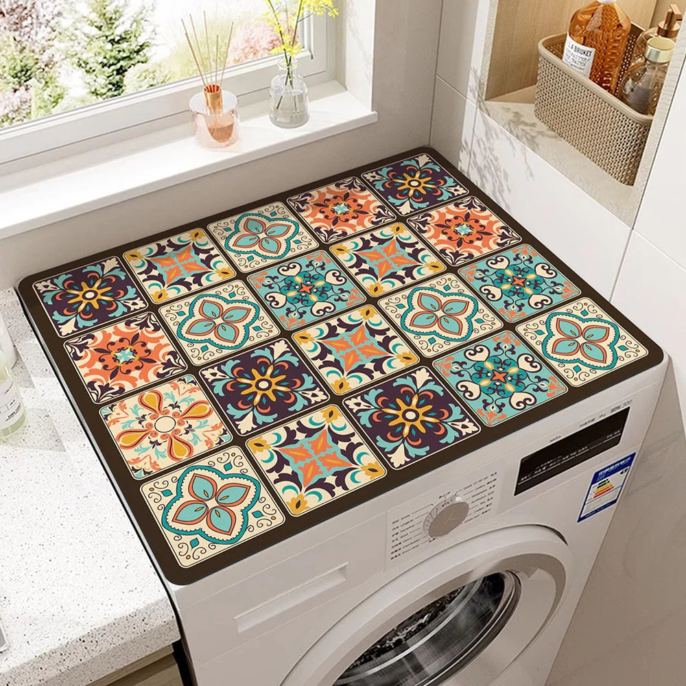 Microfiber appliance mat with a colorful geometric tile pattern on top of a washing machine.