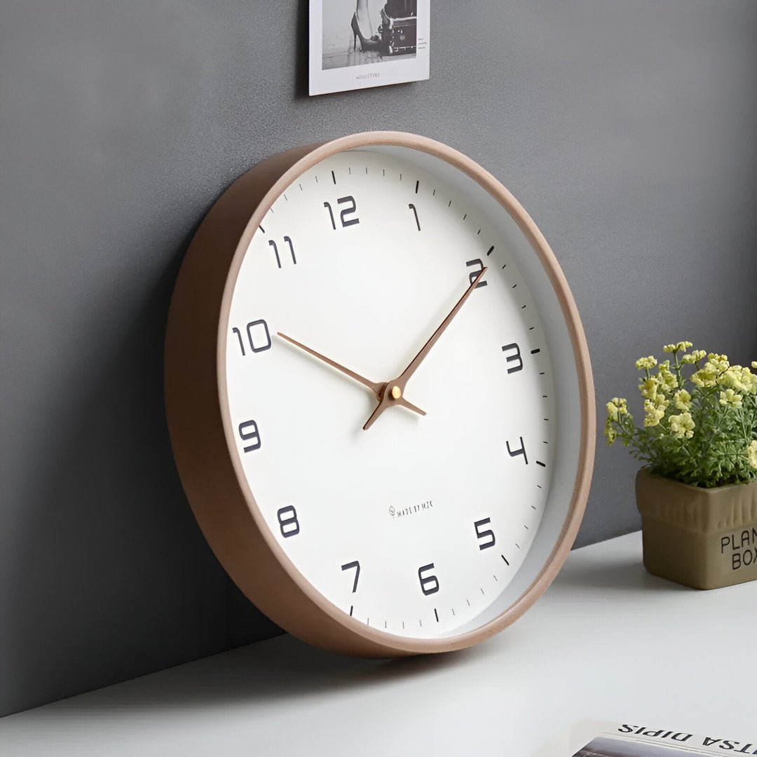 Nordic Wood Wall Clock with a white face, black numbers, and a light wood frame.