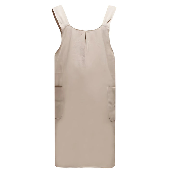Beige linen cross-back apron with two front pockets.