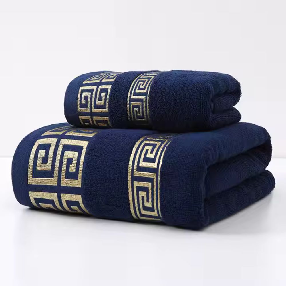 Navy blue cotton towel set with gold Greek key pattern.
