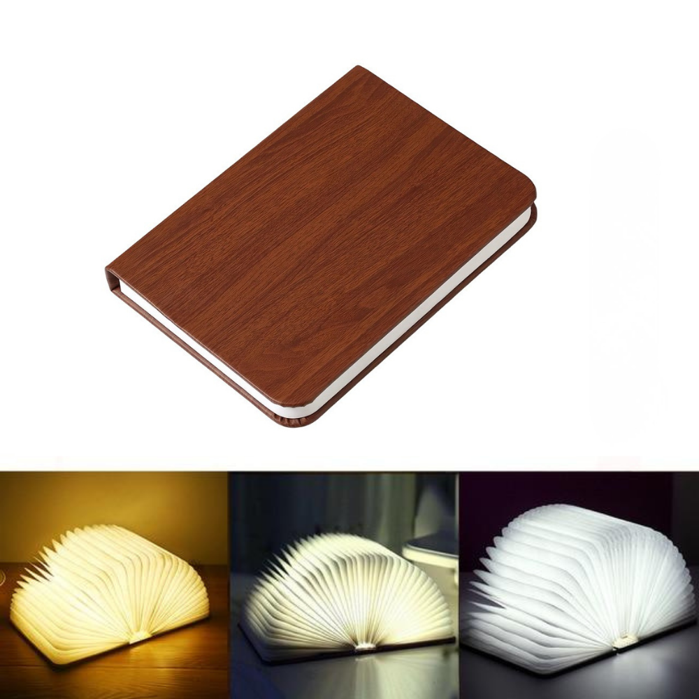 Wooden book lamp open and lit, showing adjustable light modes.