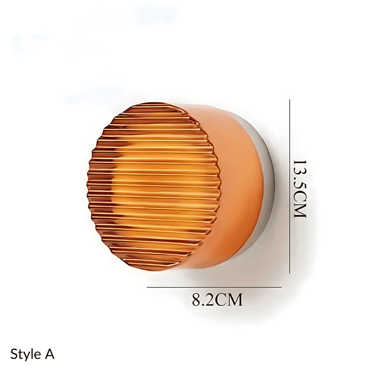 Style A metal and glass wall sconce, 8.2cm wide and 13.5cm tall.