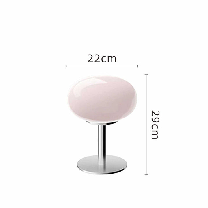 Pink glass table lamp with a chrome base, 22cm wide and 29cm tall.