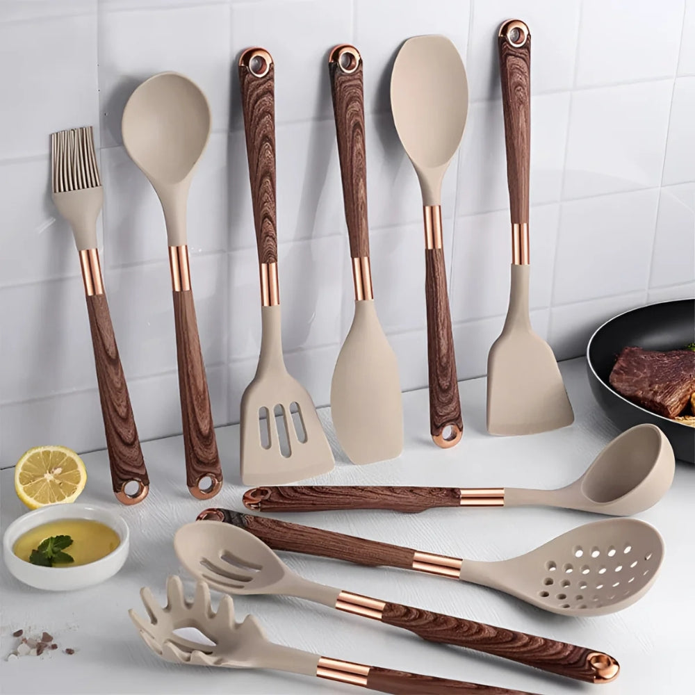 A 10-piece set of beige silicone kitchen utensils with wood-grain handles and rose gold accents.