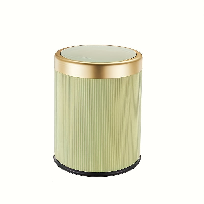 Green cylindrical trash can with a gold rim and a light green lid.