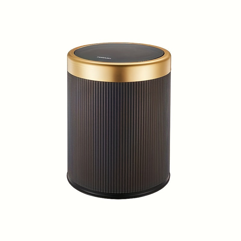 Dark ribbed cylindrical trash can with a gold rim and black press-top lid.