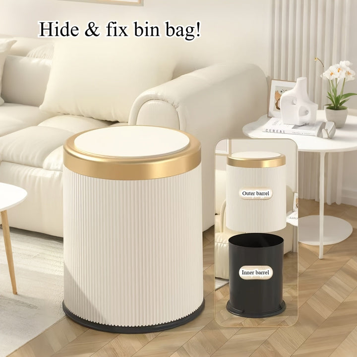Cream trash can with gold rim and lid, showing inner black bucket. Text: Hide &amp; fix bin bag!