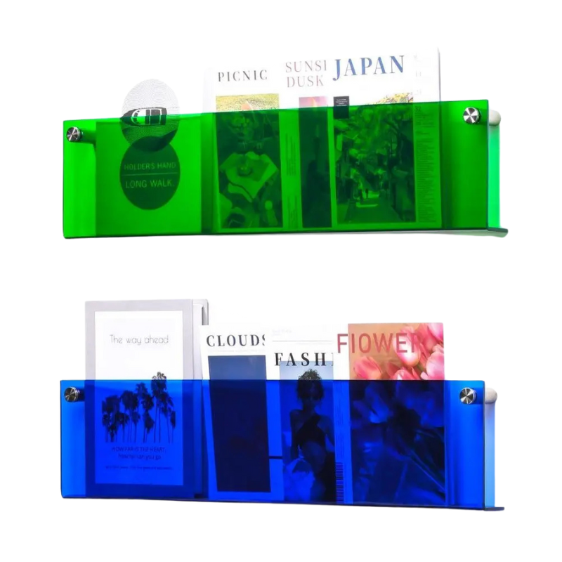 Two modern acrylic floating shelves, one green and one blue, displaying magazines and books.