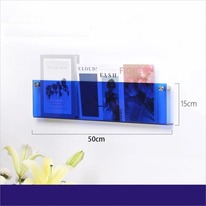 Blue acrylic floating shelf, 50cm long and 15cm high, displaying books and magazines.