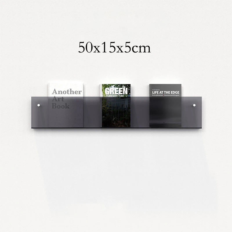 50cm modern acrylic floating shelf displaying three books on a white wall.