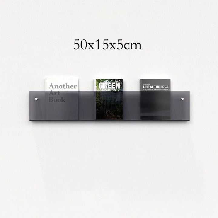 50cm modern acrylic floating shelf displaying three books on a white wall.