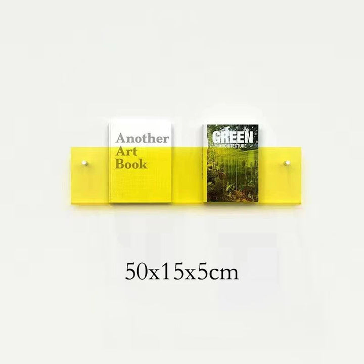 Yellow acrylic floating shelf holding two books, one titled &