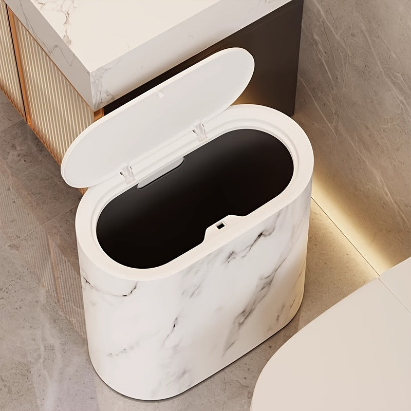 Modern marble trash can with an open oval lid, featuring a white marble pattern.