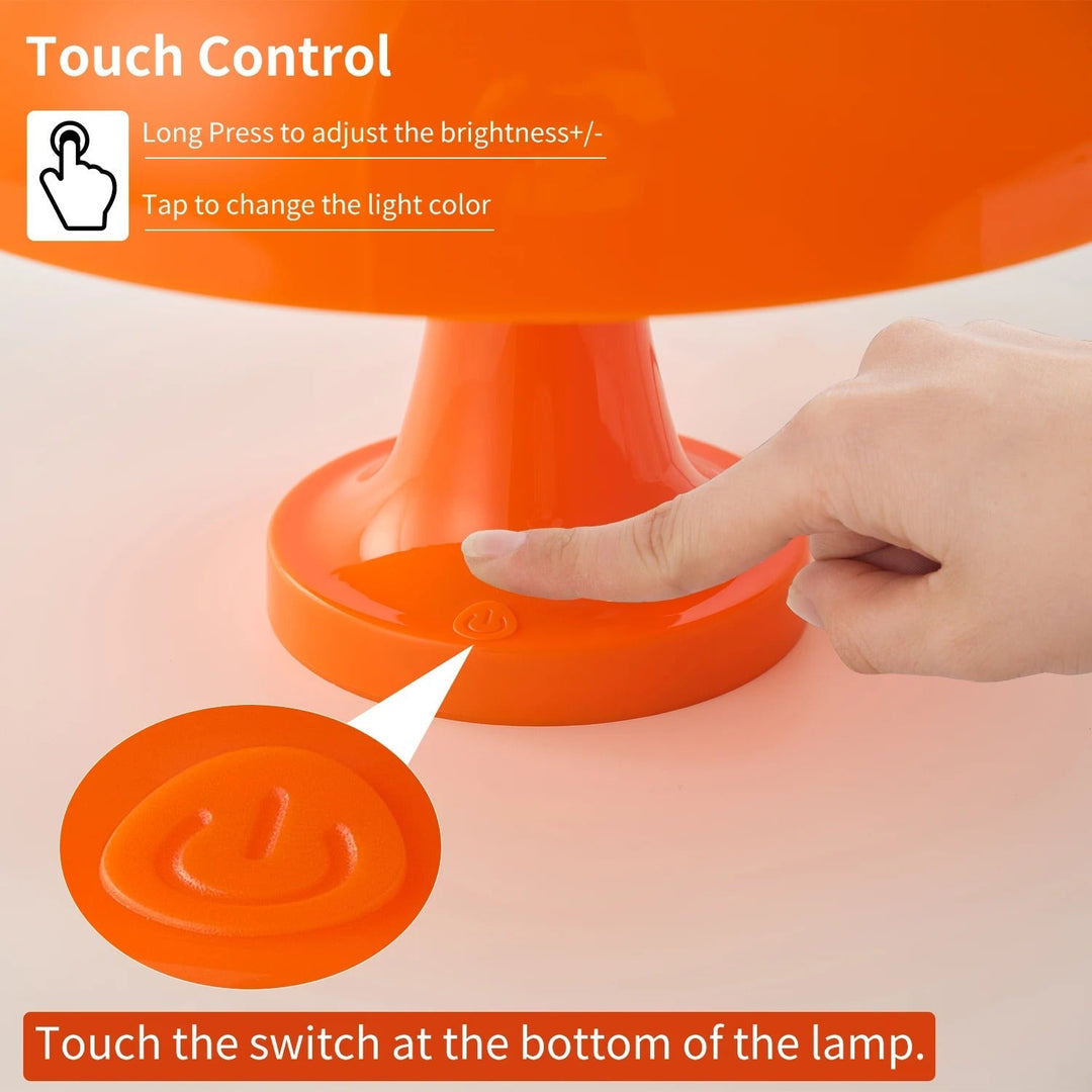 Orange LED mushroom table lamp with touch control for brightness and color adjustment.