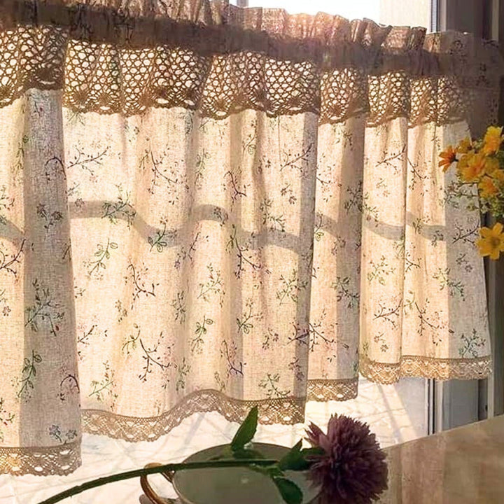 Nordic Bloom kitchen curtain with a floral pattern and lace trim, letting sunlight filter through.