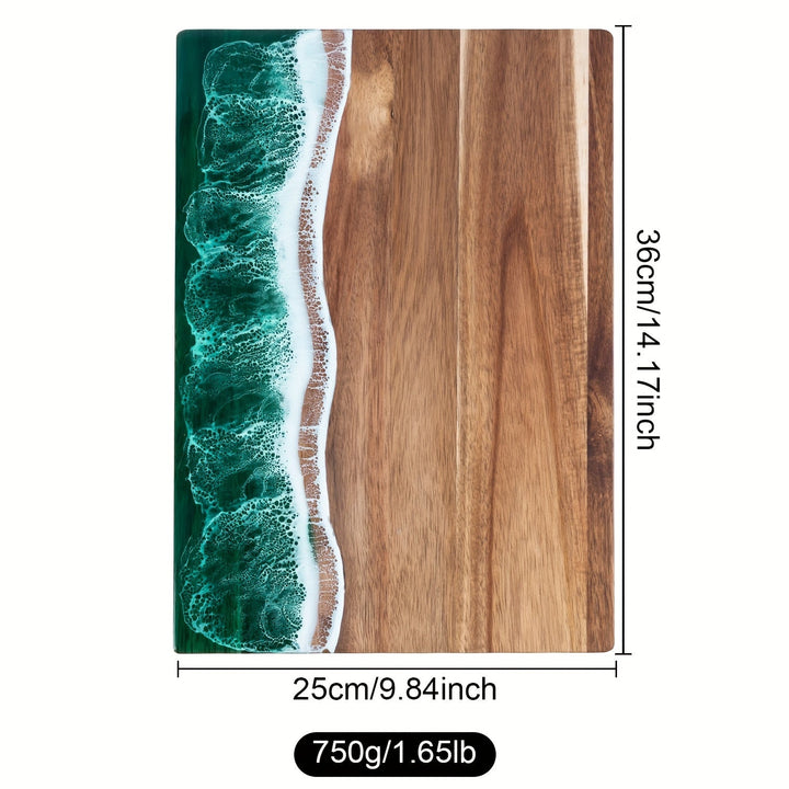 Acacia wood cutting board with a green ocean resin wave design along one edge. Dimensions 36cm x 25cm.