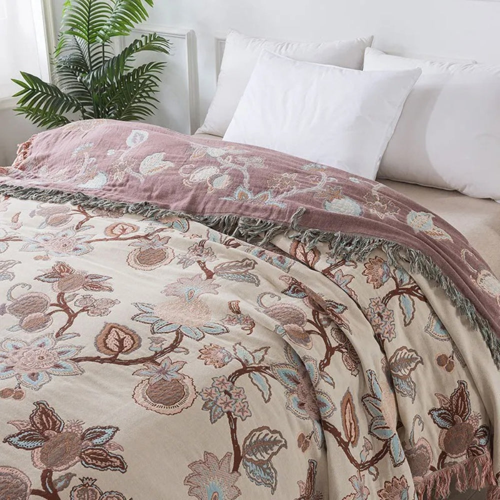 Orchid Trail Floral Cotton Tassel Bed Blanket in Dusty Rose Bloom with tassels.
