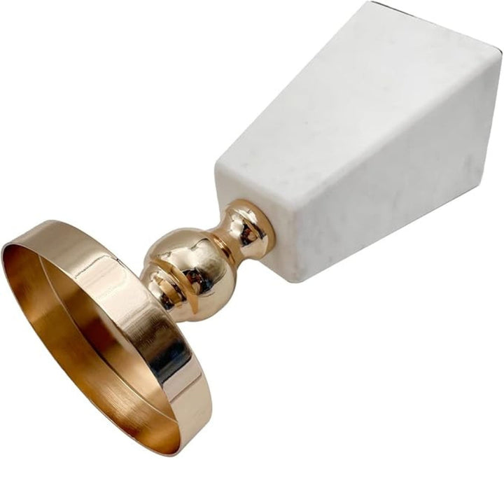 Pyramid marble candle holder with a gold base and ring accent.