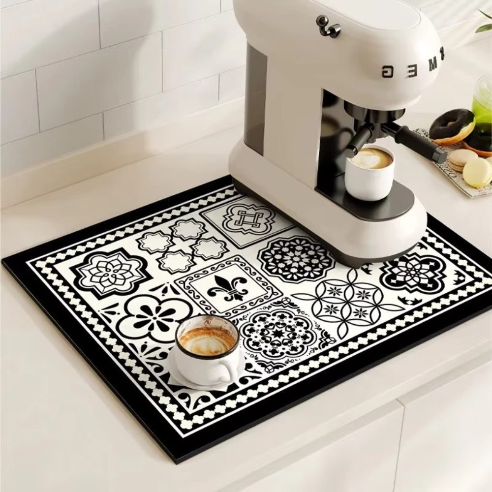 Retro tile coffee mat with a coffee machine and cup on it.