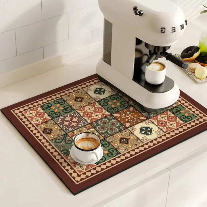 Retro tile coffee mat with a coffee machine and cup on it.