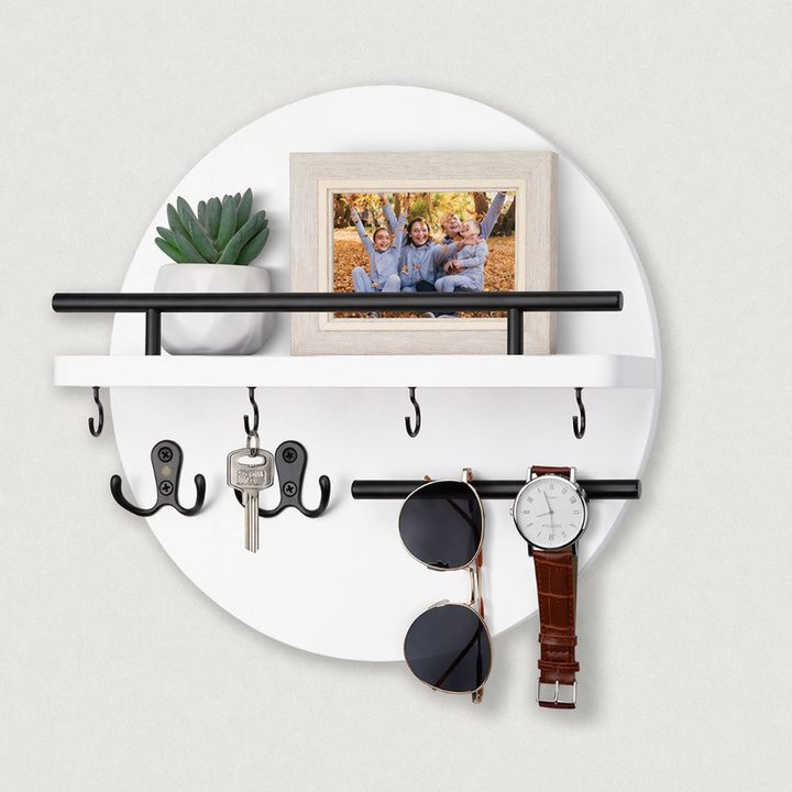 Round wooden key holder with shelf, hooks, photo frame, plant, sunglasses, and watch.