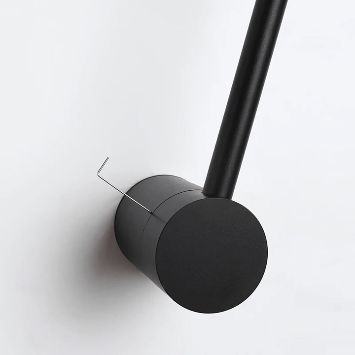 Black satin wall sconce with an Allen wrench inserted into the side.