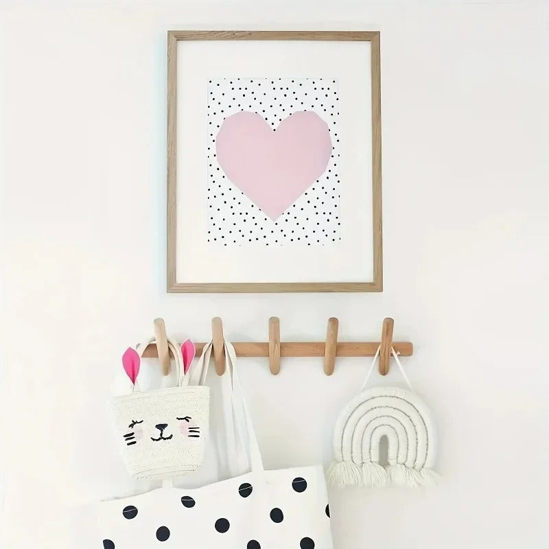 Solid oak wall coat rack with five pegs, holding a white bunny bag and a white tote bag.