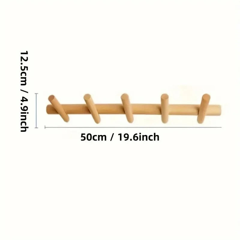 Solid oak wall coat rack with five pegs, measuring 50cm long and 12.5cm high.