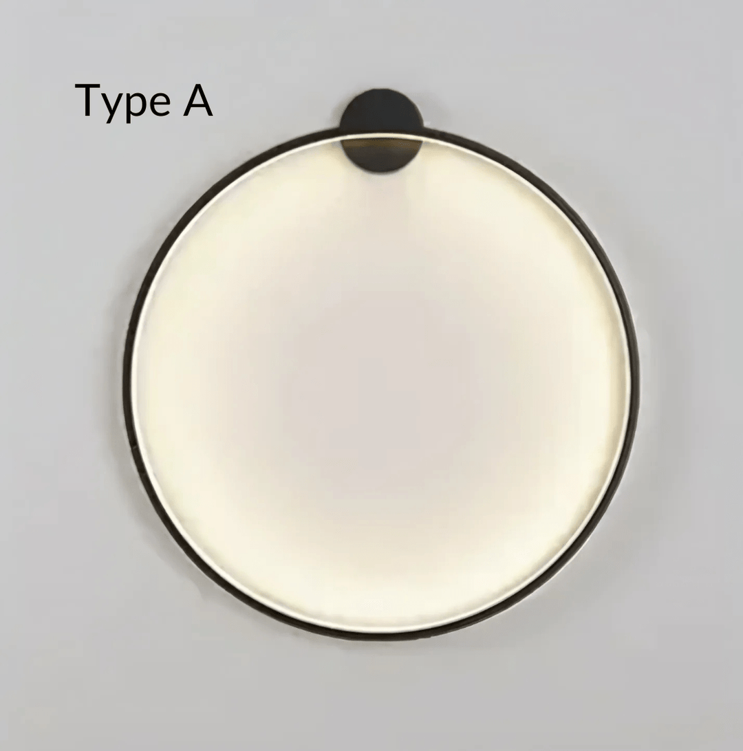 Type A modern round wall sconce with a black frame and a frosted white diffuser.
