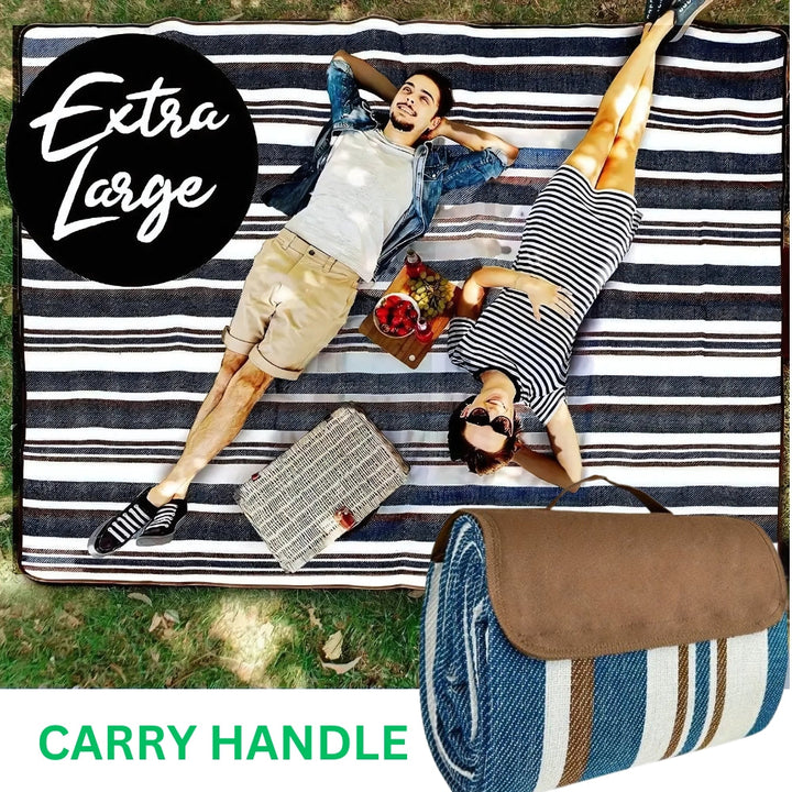 Extra large waterproof picnic mat with a carry handle, shown with a couple enjoying a picnic.