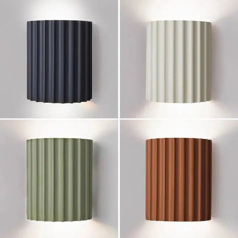 Four contemporary LED wall sconces in dark gray, off-white, sage green, and terracotta.