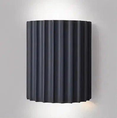 Dark grey fluted cylindrical wall sconce with integrated LED lighting.