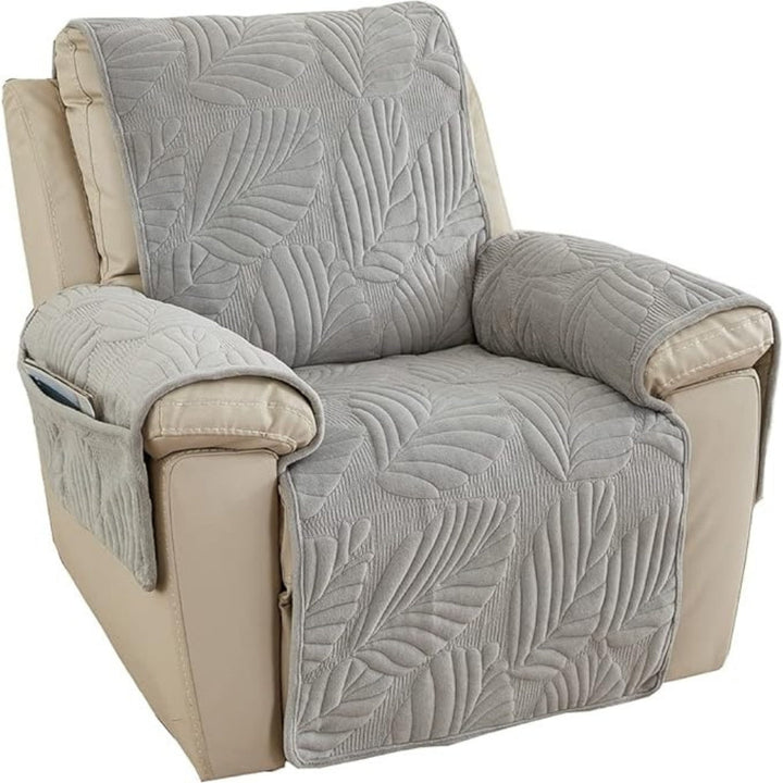 Gray recliner chair cover with a leaf pattern and side pockets.