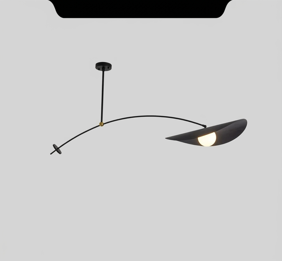 Black adjustable pendant light with a curved arm and a leaf-shaped shade housing a light bulb.