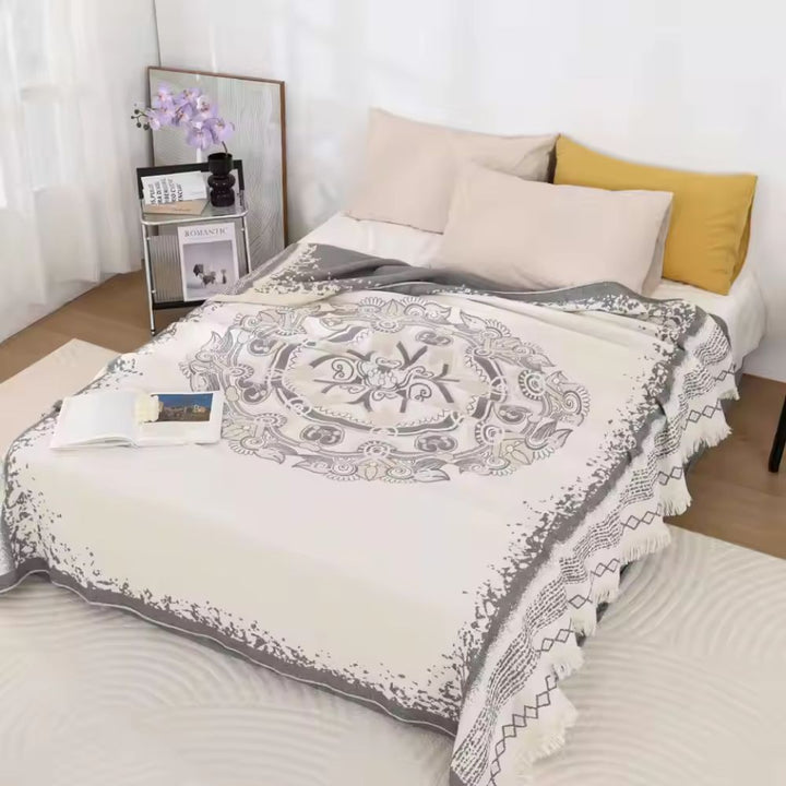 Cotton boho mandala blanket in cream with grey mandala pattern and fringe.