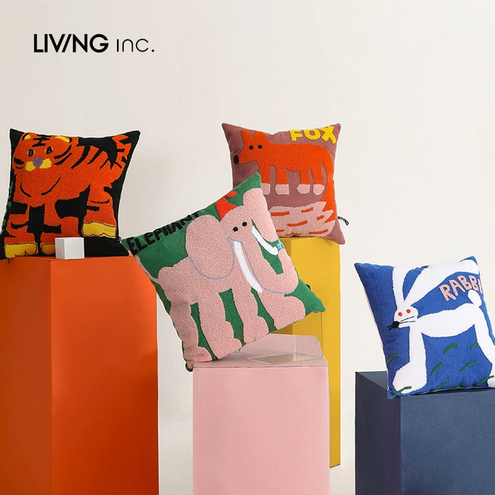 Four decorative throw pillows with animal designs: a tiger, a fox, an elephant, and a rabbit.