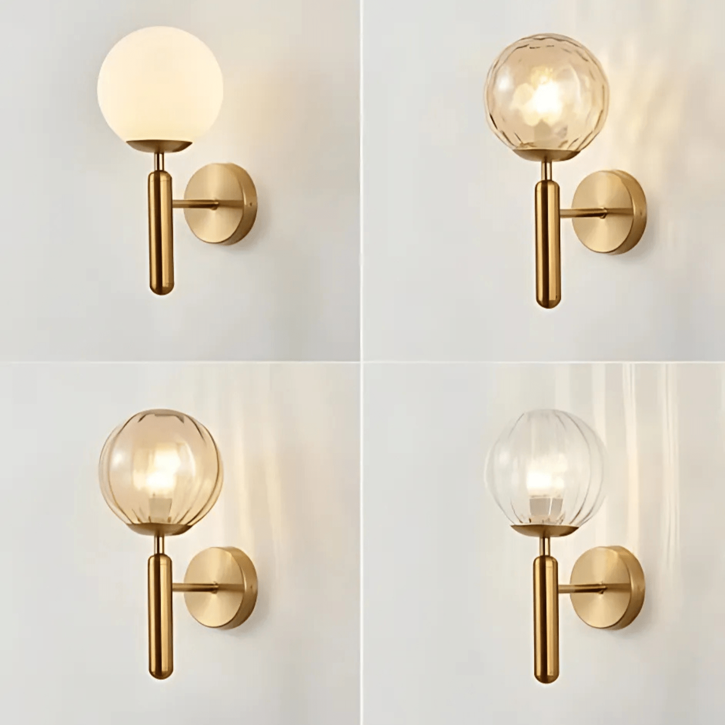 Brass wall sconce with a round frosted glass shade and a cylindrical brass arm.